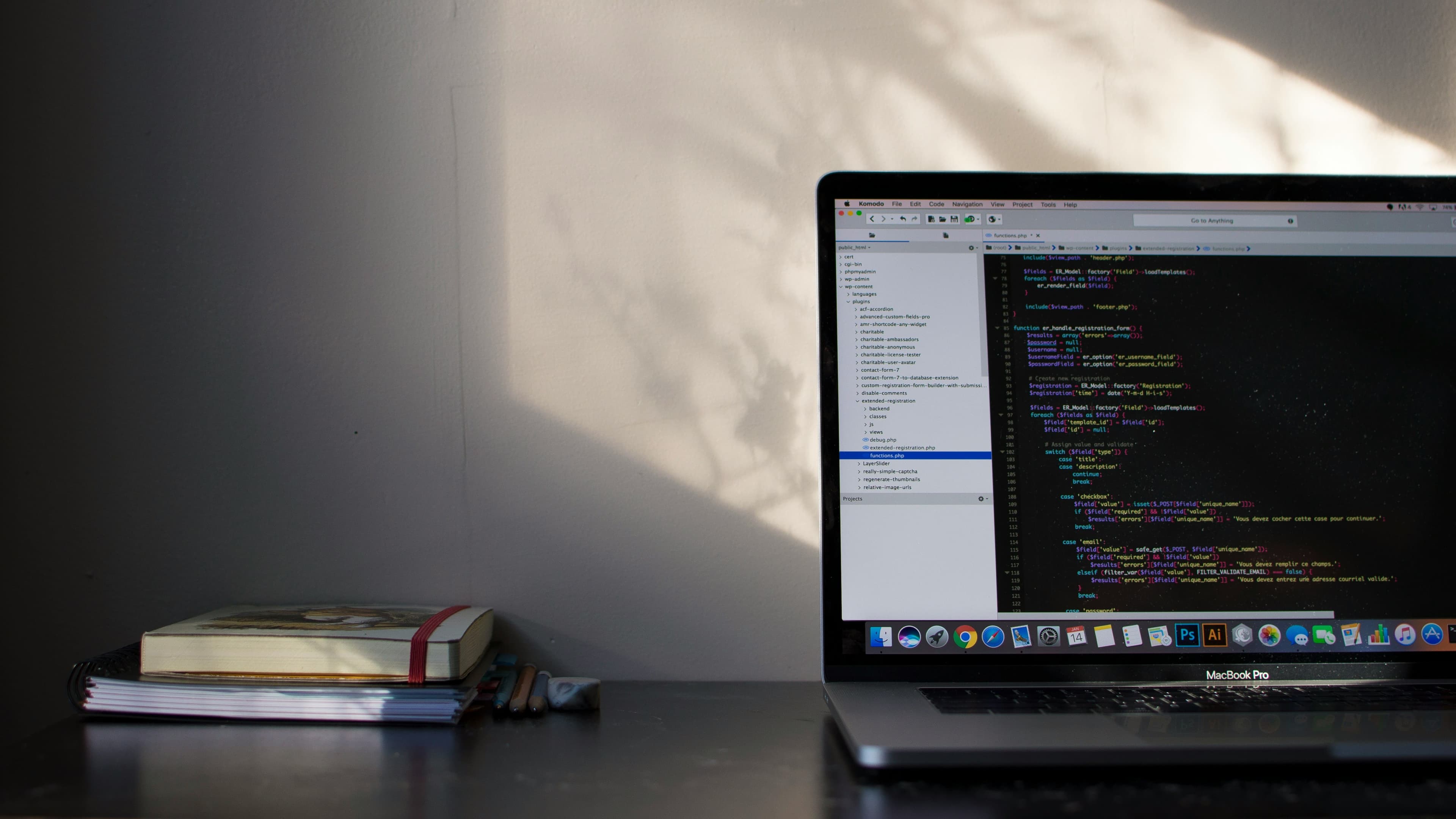 Developer workspace with code editor and books